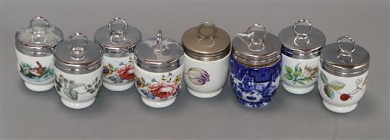 Thirty-five Royal Worcester small porcelain egg coddlers, variously decorated, including two Grainger Imari
